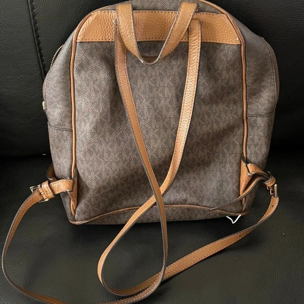 Michael‎ Kors brown monogram backpack purse with gold hardware